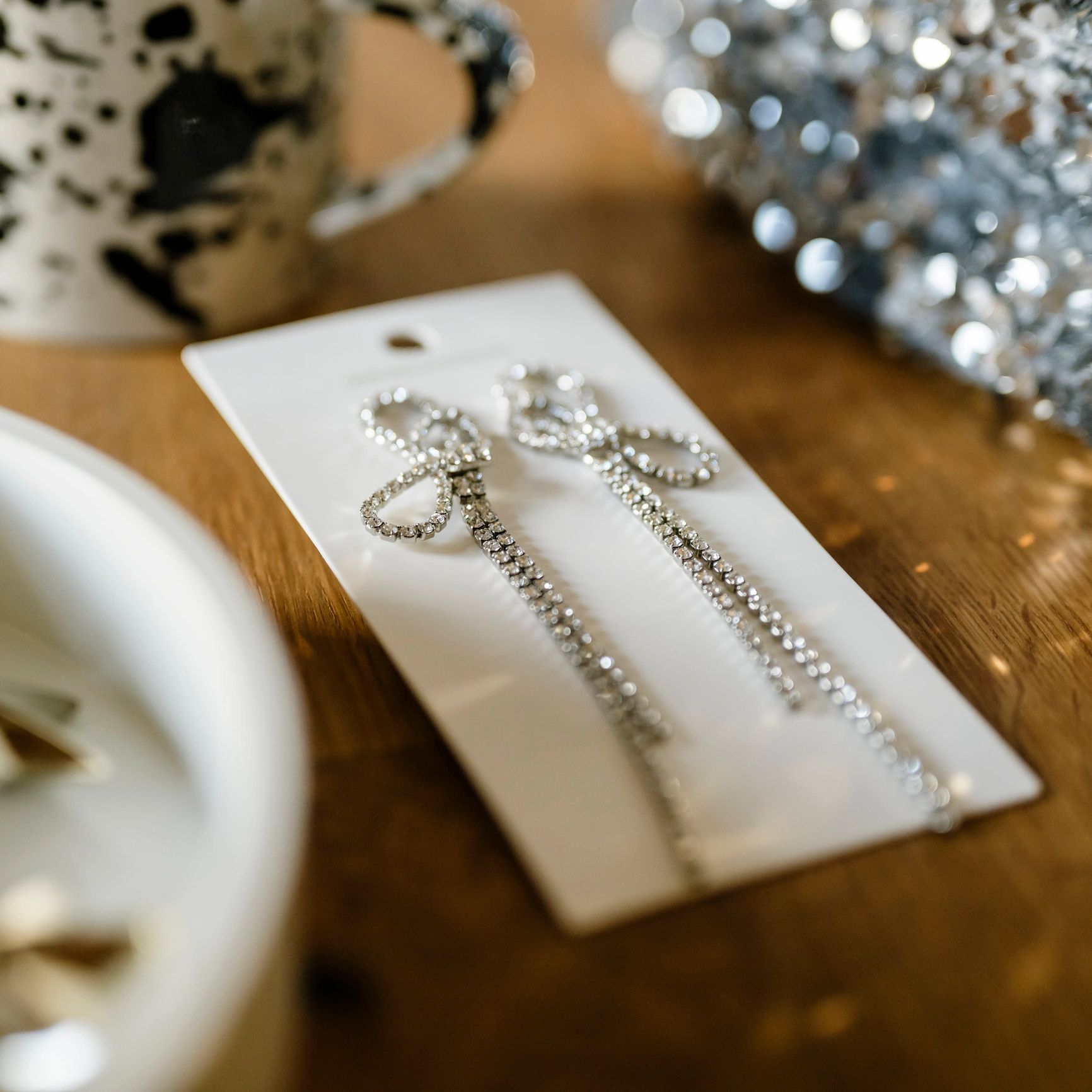 Sparkling jewelry accessories styled in a refined flat lay