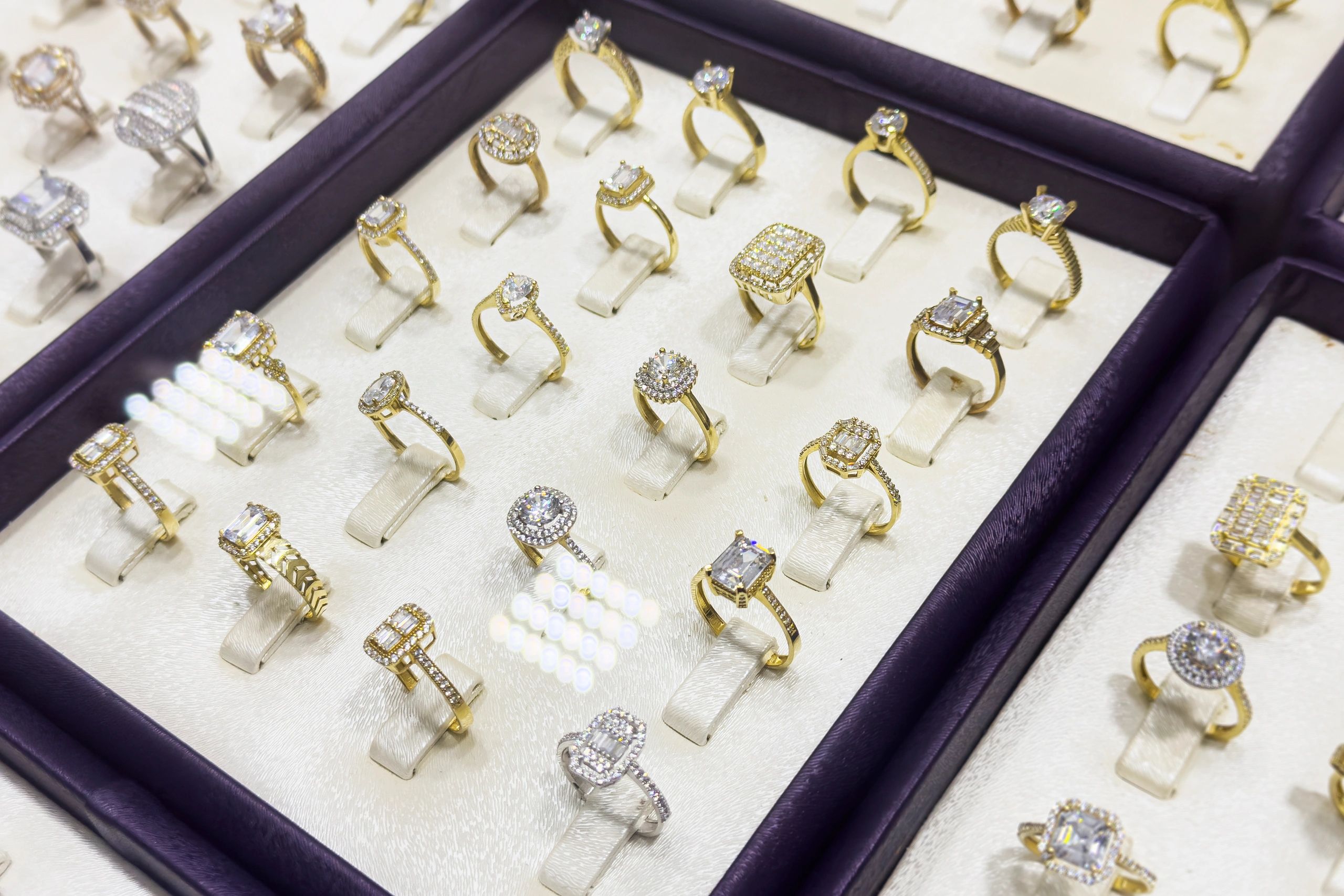 Showcase of gold rings with diamonds and precious stones