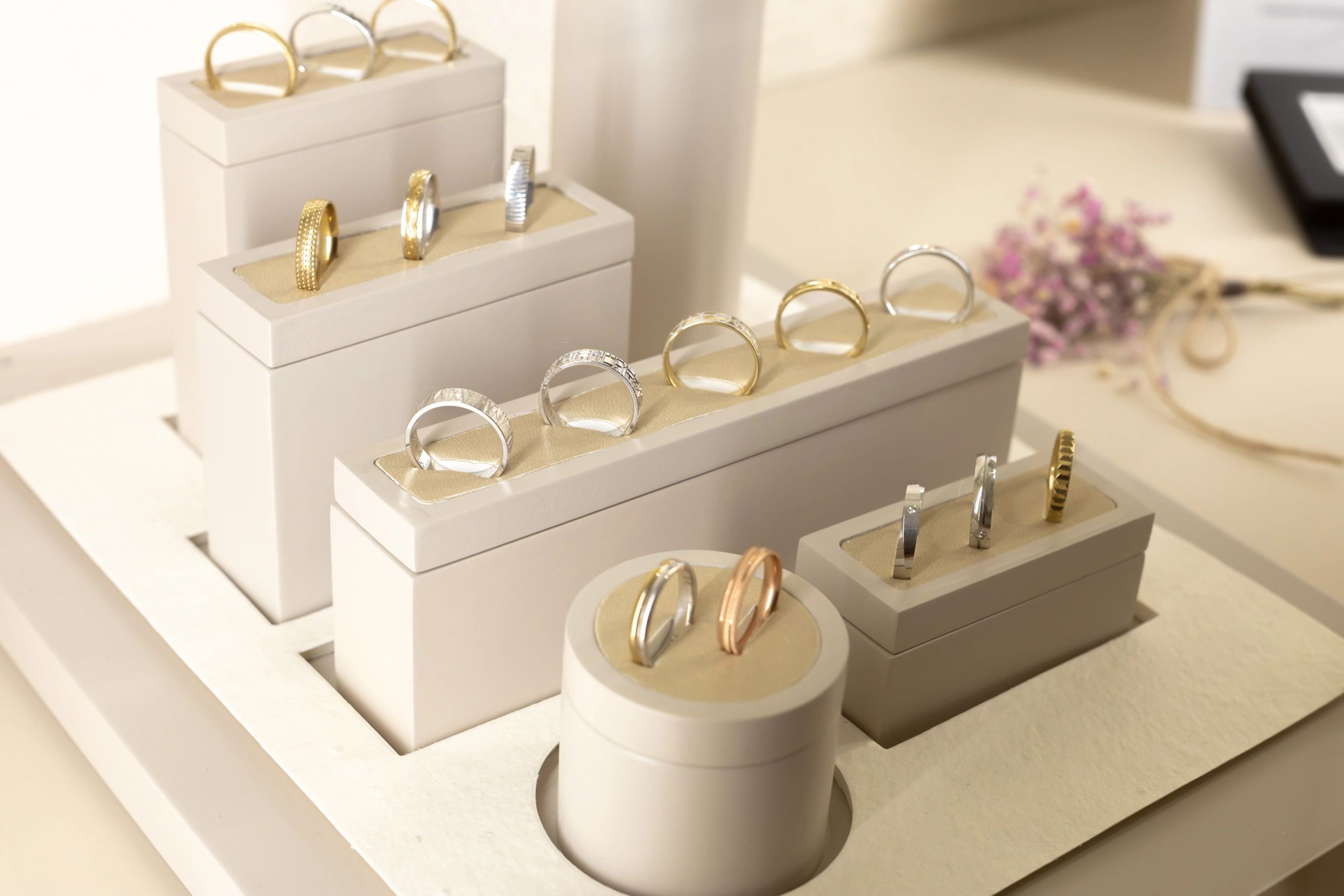 Jewelry store display featuring curated rings in multiple finishes